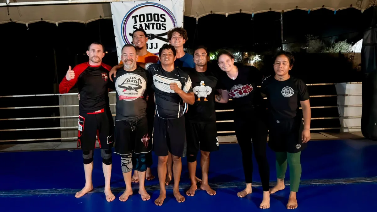 Adults gathered after an evening session at Todos Santos BJJ in El Pescadero