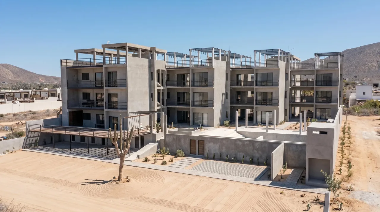 Ciudad Cerritos under construction, four-storey concrete building seen from the front