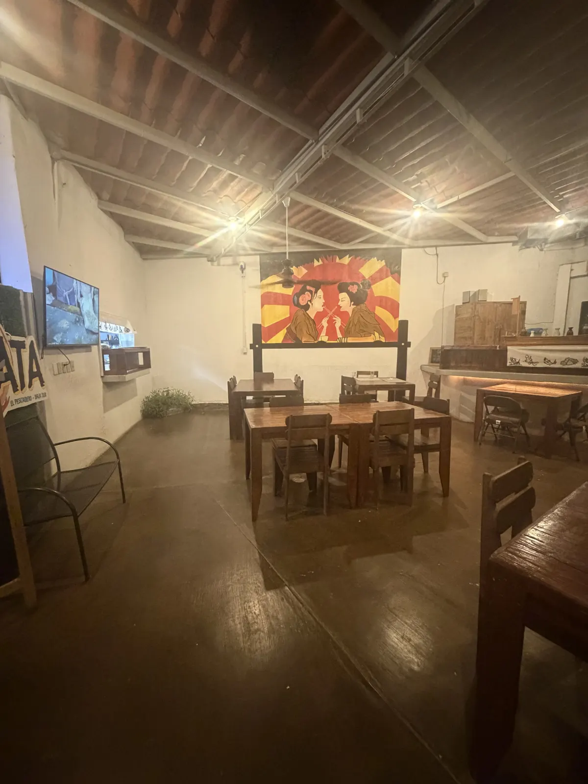 Open-air dining room and geisha mural at Sushi Bar Kata
